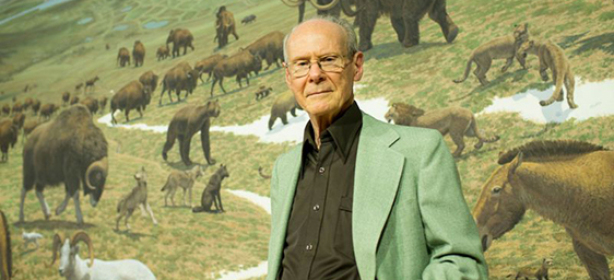 Jay Matternes in front of mural