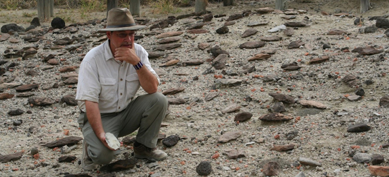 Rick Potts looks at handaxes at Olorgesailie